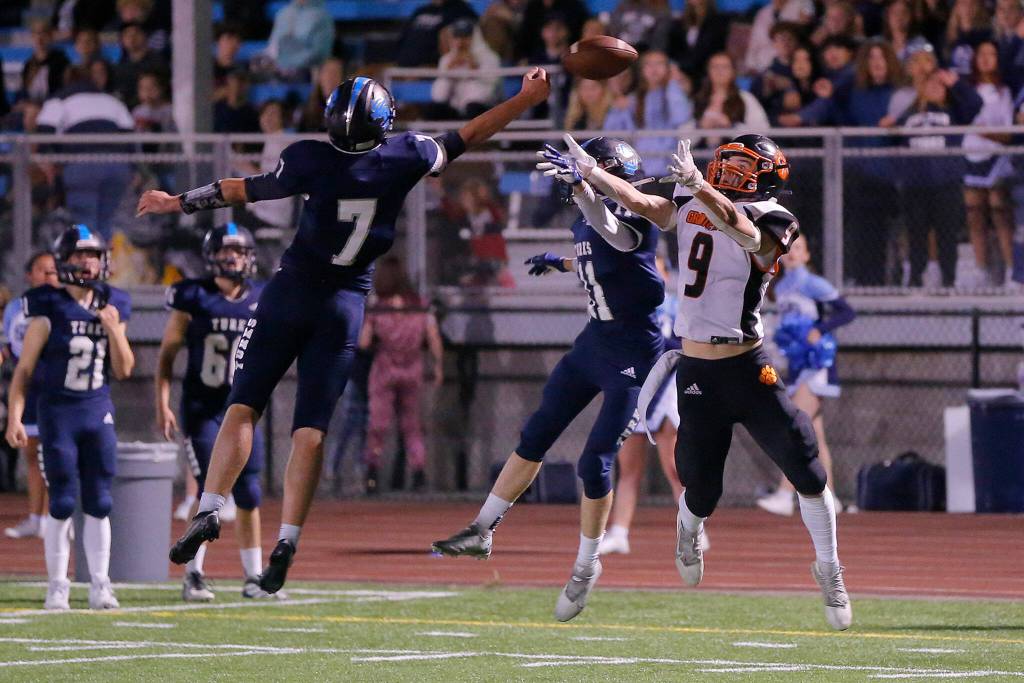 Two Sultan defenders make the final defensive stop to secure a victory against Granite Falls on Friday, Sep. 30, 2022, at Sultan High School in Sultan, Washington. (Ryan Berry / The Herald)