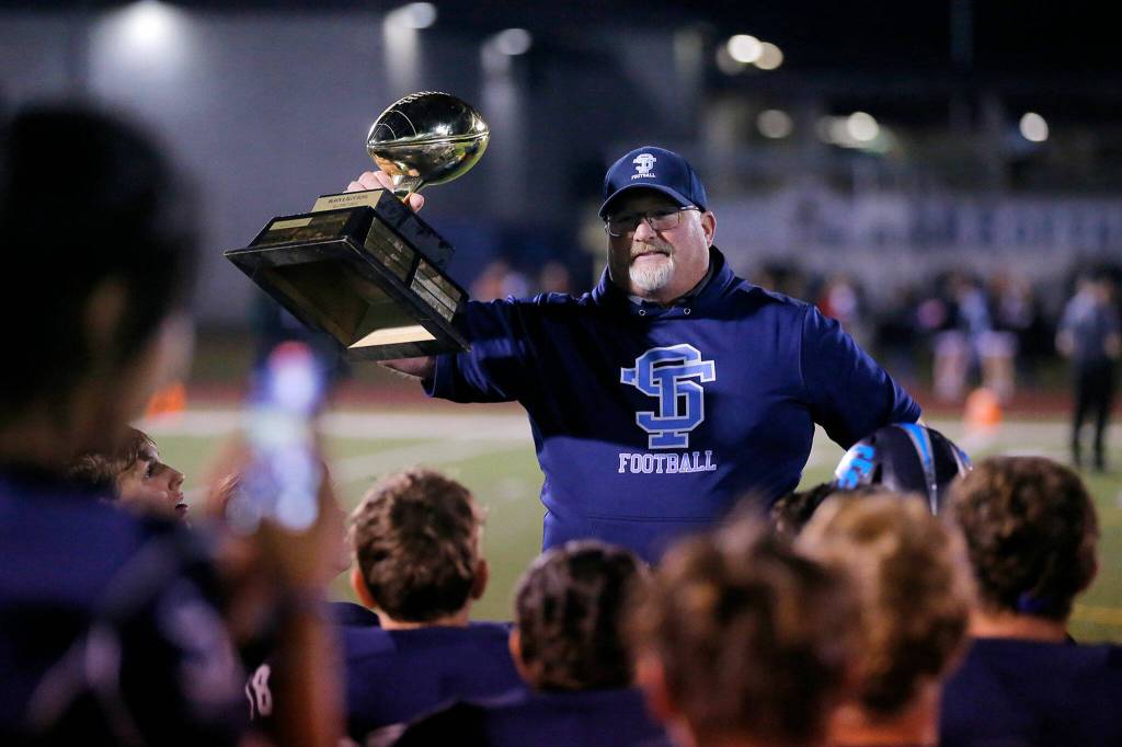 Sultan head coach Rick Rudd talks to his team after their Black and Blue Bowl win over Granite Falls on Friday, Sep. 30, 2022, at Sultan High School in Sultan, Washington. (Ryan Berry / The Herald)