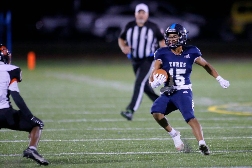 Sultans Julio Vargas tries to fake out a defender while running in the open field against Granite Falls on Friday, Sep. 30, 2022, at Sultan High School in Sultan, Washington. (Ryan Berry / The Herald)