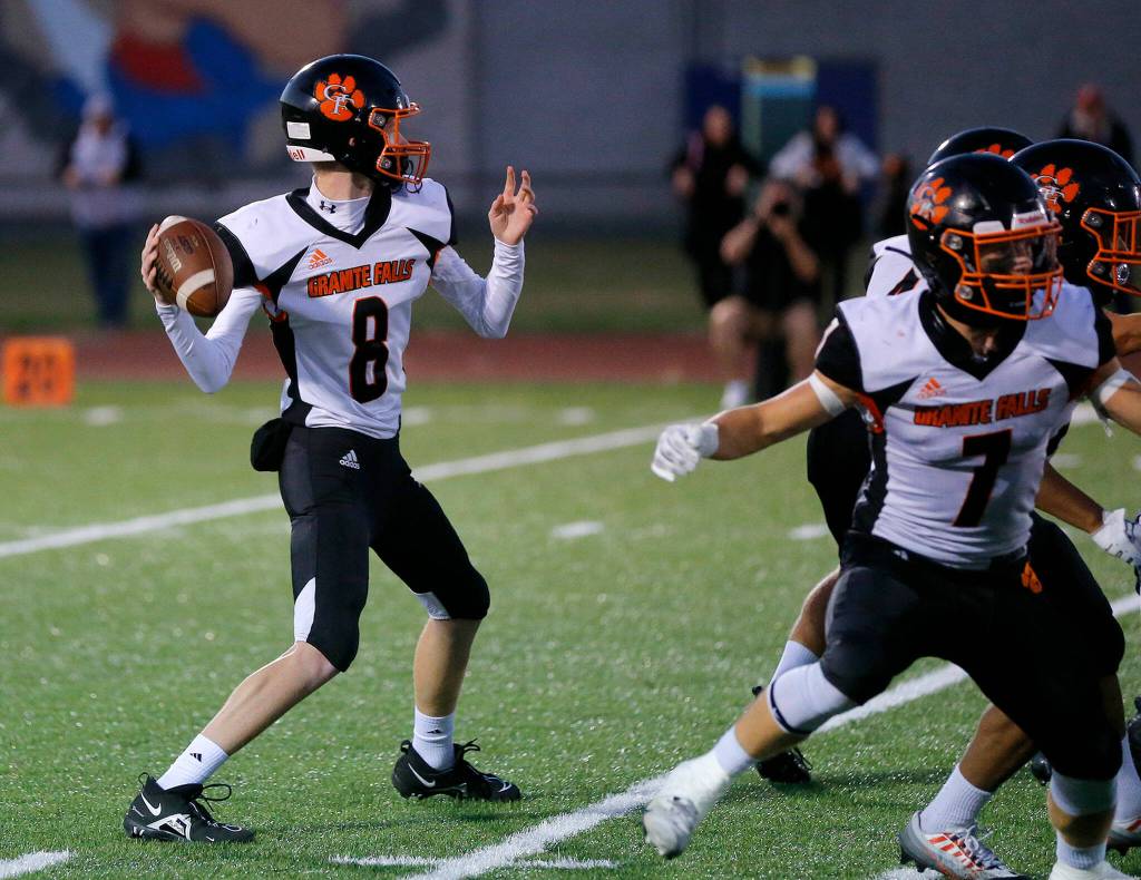 Granite Falls Jack McGill winds up to throw against Sultan on Friday, Sep. 30, 2022, at Sultan High School in Sultan, Washington. (Ryan Berry / The Herald)