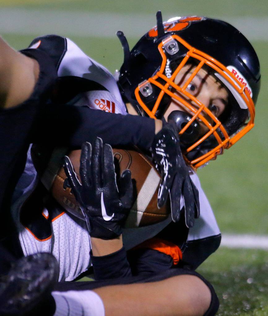 Granite Falls Parker Kern looks up for a referees call after nearly catching a low throw against Sultan on Friday, Sep. 30, 2022, at Sultan High School in Sultan, Washington. (Ryan Berry / The Herald)