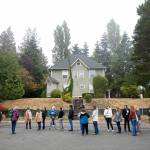 Dozens of volunteers from the community line up and act as parents of students during an Everett Public Schools emergency drill on Thursday, at Everett Memorial Stadium in Everett. (Ryan Berry / The Herald)
