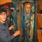 Jerry Wennstrom with “Lightning,” a multi-layered sculpture. Wennstrom’s second body of artistic work consists of several tall, wooden sculptures resembling women that are meant to represent complex themes of birth and death, good and evil, femininity and masculinity. (David Welton)