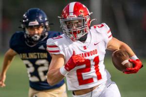 Stanwood’s Otto Wiedmann runs the ball during the Stilly Cup against Arlington on Friday, Sept. 30, 2022 in Arlington, Washington. (Olivia Vanni / The Herald)