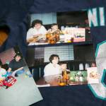 Photos of James Muramoto, now 29, and late grandmother Edie Galen lay on a Dan Wilson shirt at Muramotos familys home on Thursday, in Everett. (Ryan Berry / The Herald)