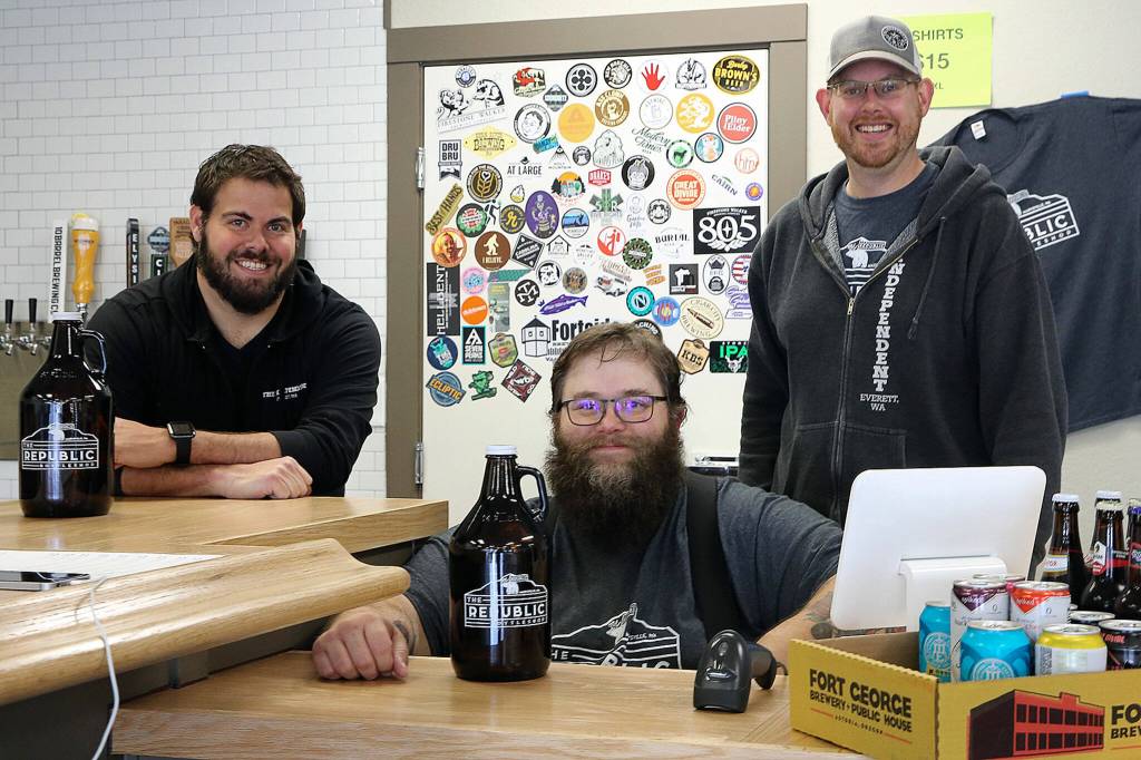 The Republic Bottleshop owners, Jeff Sadighi (left-right) TJ Borden and Doug Hall on April 24, 2020, in Marysville. (Kevin Clark / The Herald)