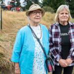 Phyllis Hopkins, left, and Debbie Wetzel at the site of the Cathcart Crossing project on Thursday, Sept. 22, 2022 in Cathcart, Washington. Hopkins is one of 13 neighbors who was left out of the loop about a public hearing and comment period for the proposed development, an appeal alleges. (Olivia Vanni / The Herald)