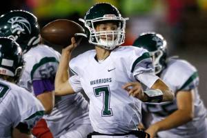 Edmonds-Woodway’s Steven Warren Jr. steps up in the pocket to make a pass against Snohomish on Friday, Sep. 23, 2022, at Snohomish High School in Snohomish, Washington. (Ryan Berry / The Herald)