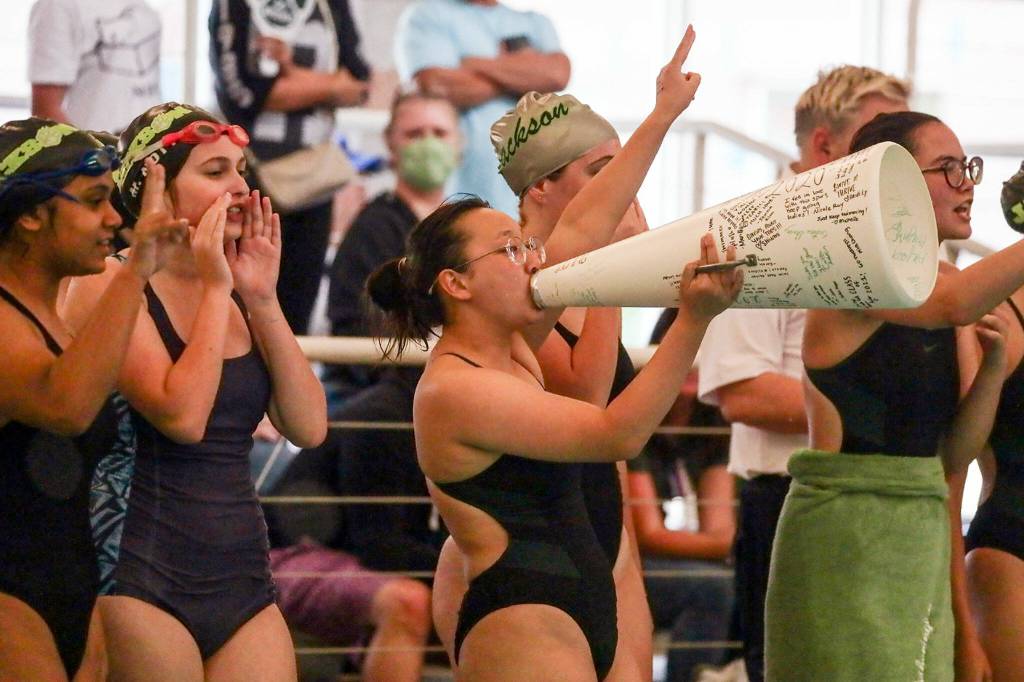 Jackson teammates cheer Thursday afternoon at Kamiak High School in Mukilteo, Washington on October 6, 2022. (Kevin Clark / The Herald)
