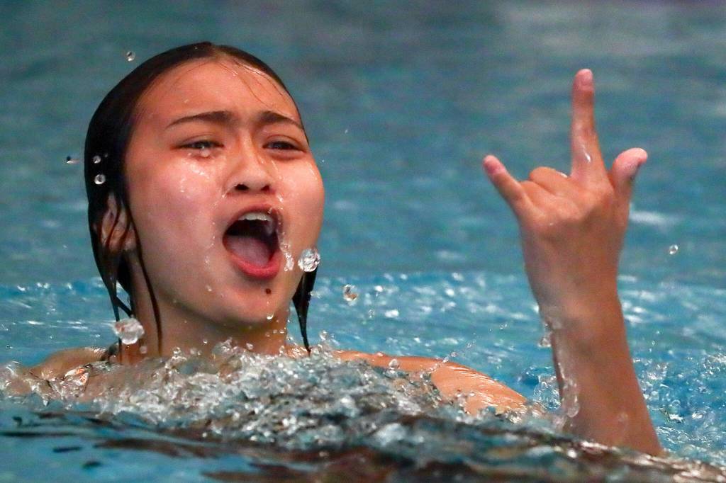 Jacksons Dhamin Parungao reacts to her teammates after her dive Thursday afternoon at Kamiak High School in Mukilteo, Washington on October 6, 2022. (Kevin Clark / The Herald)