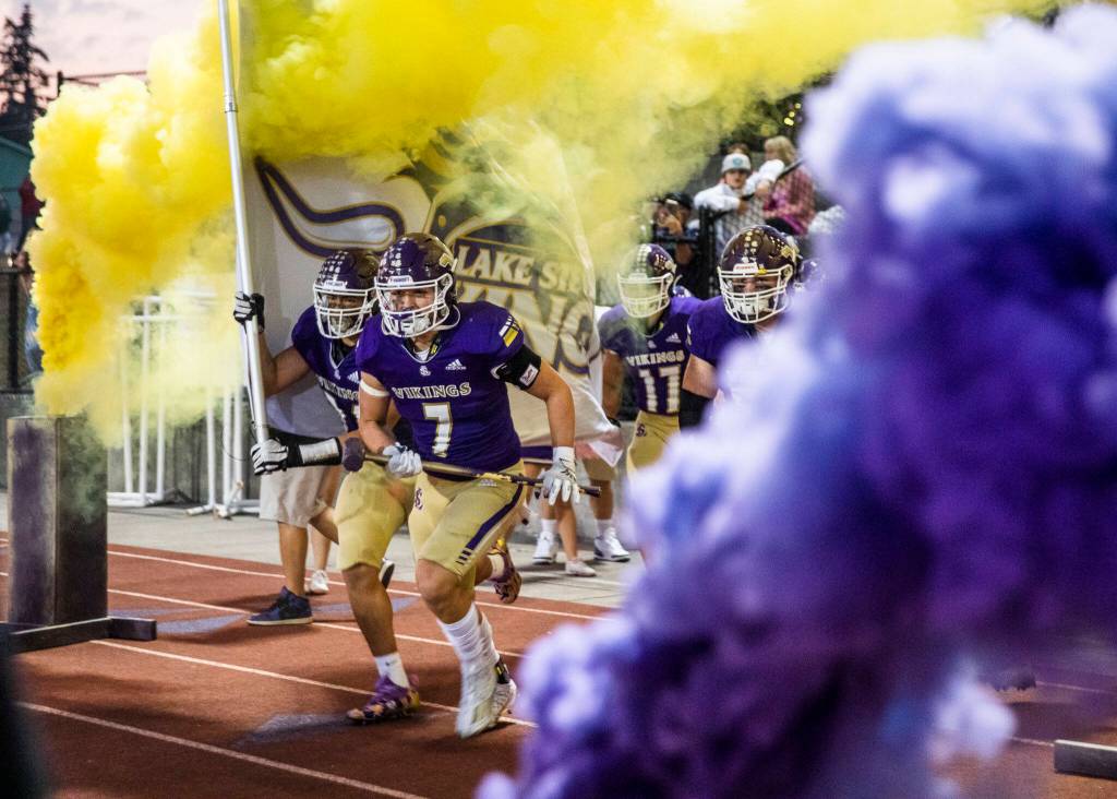 The Lake Stevens players run out onto the field before the start of the game against Eastlake on Friday, Oct. 7, 2022 in Lake Stevens, Washington. (Olivia Vanni / The Herald)