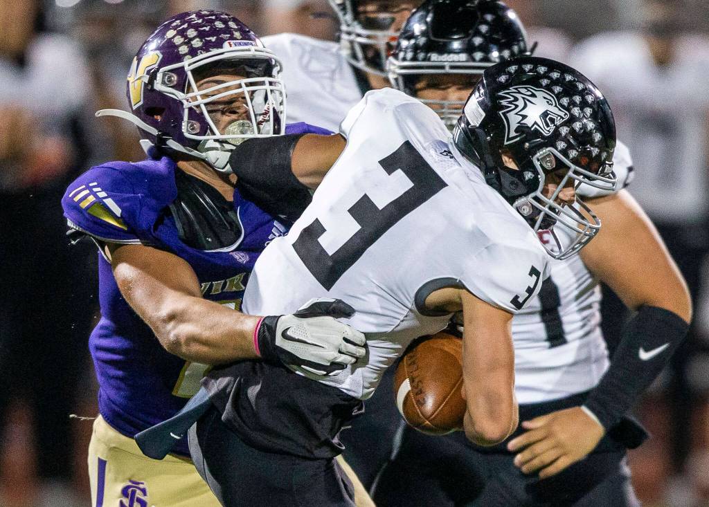 Lake Stevens Micah Avery sacks Eastlake quarterback Cole Hunt during the game on Friday, Oct. 7, 2022 in Lake Stevens, Washington. (Olivia Vanni / The Herald)