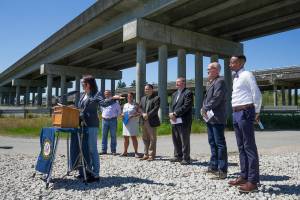 With other officials behind her, u.S. Rep. Suzan DelBene (WA-01) speaks at a press conference underneath the US 2 trestle on Wednesday, June 2, 2021 in Lake Stevens, Washington. The elected officials gathered  to make their case for how an injection of federal funds into the nation’s transportation infrastructure could lead to less congested and safer commutes for Snohomish County residents. (Andy Bronson / The Herald)