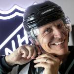 Caption: Vaughan Rody dons his linesman gear for the first time since his final NHL game in April, on Monday, June 6, 2022, at his home in Lake Stevens, Washington. Rody officiated in the National Hockey League for 23 seasons. (Ryan Berry / The Herald)

Description: We had to dig through the garage to find his uniform, but we figured it out. 

“Still smells,” exclaimed Vaughan Rody, who had just retired from his 23-year career as a linesman in the NHL.

Since his final game nearly two months earlier, Rody hadn’t touched his uniform, but when I visited his Lake Stevens home knowing I needed a portrait of him in his gear, he happily scoured the house in search of his striped sweater and helmet.

We went upstairs to his memorabilia room, he threw on the sweater we had found in a gym bag and I turned off the lights, opting for the window light coming from my left. Using the oldest lens in my bag — a 50mm I bought as a teenager — I asked Rody to slowly put on his helmet as I fired off a couple dozen frames. I made some adjustments to the camera, and had him do it again. And again. And, you know, one more time please? Each smile was as genuine as the last, and within two minutes we had the photo I had hoped for.

It takes two to make a portrait, and I cherish the opportunity to work with people who give so much of themselves to the camera. Assignments like these leave a positive mark and really help me keep going.

At 50mm, the focal length used here minimizes distortion of facial features and at the time gave me a wide enough frame to work with in a tight room. I shot at f/3.2 for a shallow but not-too-shallow depth of field, 1/320 of a second to avoid any type of motion blur as Rody donned his helmet, and iso 2000 simply because its what my other settings dictated in the moment.