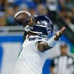 Seahawks quarterback Geno Smith reacts after his 8-yard touchdown run during the first half of a game against the Lions on Oct. 2 in Detroit. (AP Photo/Duane Burleson)