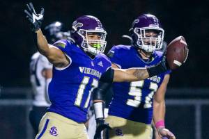Lake Stevens’ Jayden Lamar reacts to getting a touchdown during the game against Eastlake on Friday, Oct. 7, 2022 in Lake Stevens, Washington. (Olivia Vanni / The Herald)