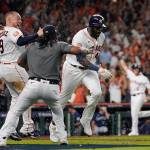 Astros designated hitter Yordan Alvarez (44) celebrates with teammates after his three-run, walk-off home run against the Mariners during the ninth inning of Game 1 of an American League Division Series game on Tuesday in Houston. (AP Photo/David J. Phillip)