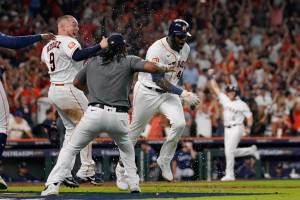 Houston Astros designated hitter Yordan Alvarez (44) celebrates with teammates after his three-run, walkoff home run against the Seattle Mariners during the ninth inning in Game 1 of an American League Division Series baseball game in Houston,Tuesday, Oct. 11, 2022. (AP Photo/David J. Phillip)
