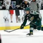 The Silvertips Dylan Anderson sends the puck behind the net during the season opener against the Giants on Sep. 24, 2022, at Angel of the Winds Arena in Everett. (Ryan Berry / The Herald)