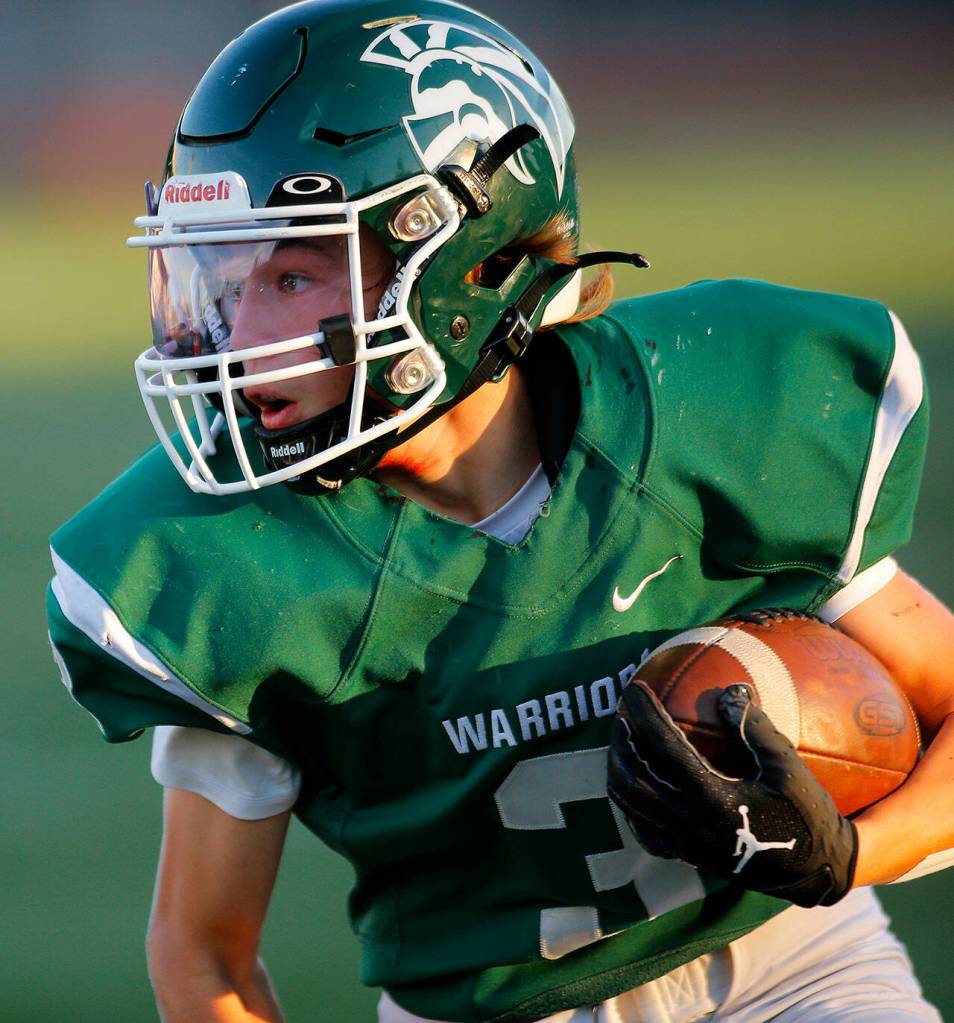 Edmonds-Woodways Cannon Kennard runs up the sideline for a solid gain against Monroe on Friday, Oct. 14, 2022, at Edmonds School District Stadium in Edmonds, Washington. (Ryan Berry / The Herald)