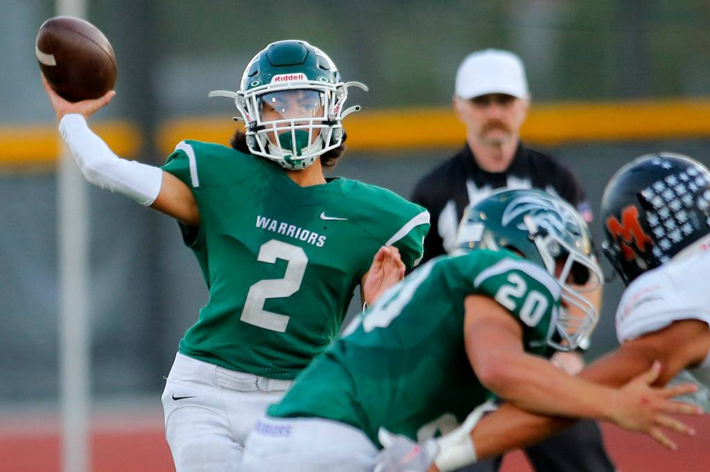 Edmonds-Woodway backup quarterback Diego Escandon throws a short screen pass against Monroe on Friday, Oct. 14, 2022, at Edmonds School District Stadium in Edmonds, Washington. (Ryan Berry / The Herald)