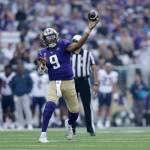 Washington quarterback Michael Penix Jr. throws a touchdown pass against Arizona during the first half of an NCAA football game, Saturday, Oct. 15, 2022, in Seattle. (AP Photo/John Froschauer)