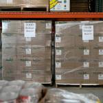 Boxes from the COVID strategic reserve are stored away in the warehouse Thursday, at the Volunteers of America food distribution center in Arlington. (Ryan Berry / The Herald)