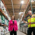 U.S. Rep. Suzan DelBene is shown around the food storage warehouse by VOA Director of Operations for Hunger Prevention Dean Johnson on Thursday, Oct. 20, 2022, at the Volunteers of America food distribution center in Arlington, Washington. (Ryan Berry / The Herald)