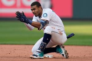 Seattle Mariners' Julio Rodriguez celebrates after hitting a double against the Houston Astros during the eighth inning in Game 3 of an American League Division Series baseball game Saturday, Oct. 15, 2022, in Seattle. (AP Photo/Abbie Parr)