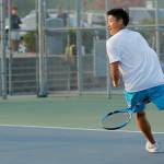 Jackson High sophomore Ben Lee hits a tweener back over the net against senior teammate Austen Lim during the 4A District 1 Singles Championship Tuesday, Oct. 18, 2022, at Glacier Peak High School in Snohomish, Washington. (Ryan Berry / The Herald)
