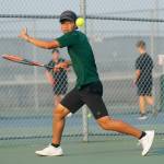 Jackson High senior Austen Lim returns a ball against sophomore teammate Ben Lee during the 4A District 1 Singles Championship Tuesday, Oct. 18, 2022, at Glacier Peak High School in Snohomish, Washington. (Ryan Berry / The Herald)