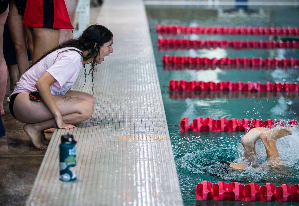 Snohomishs Ryanne Mardini cheers on her teammate during the meet against Glacier Peak on Tuesday, Oct. 18, 2022 in Snohomish, Washington. (Olivia Vanni / The Herald)