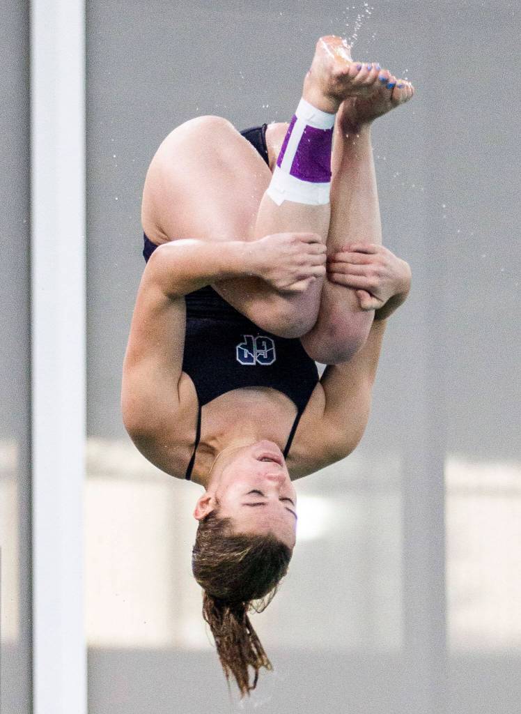 Glacier Peaks Addison Farman dives during the meet against Snohomish on Tuesday, Oct. 18, 2022 in Snohomish, Washington. (Olivia Vanni / The Herald)