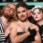 Frank_Riff_Magenta: Handyman Riff Raff (Kendall Collins), mad scientist Dr. Frank-N-Furter (Josiah Miller) and crazed domestic Magenta (Lauren Hayes) host unsuspecting guests in “The Rocky Horror Show,” playing October 21-November 6 at the Red Curtain Arts Center in Marysville. (Kenny Randall)