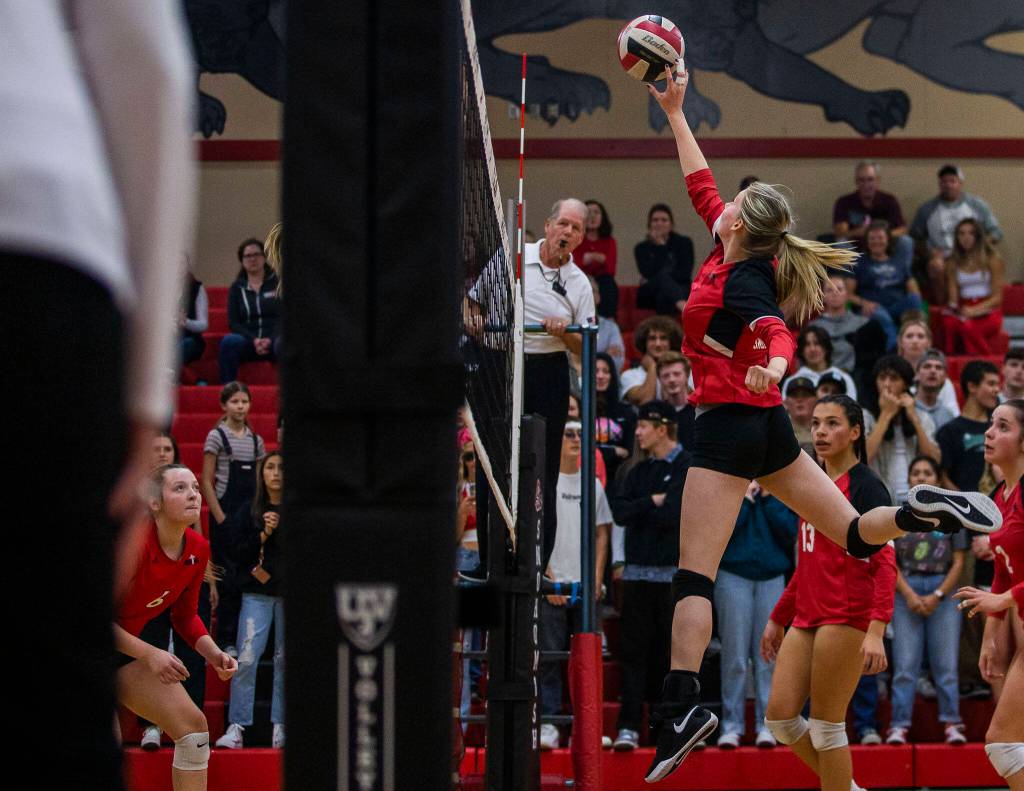 Snohomishs Reagan Bullock tips the ball over the net during the match against Archbishop Murphy on Wednesday, Oct. 19, 2022 in Snohomish, Washington. (Olivia Vanni / The Herald)