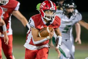 Marysville Pilchuck’s Joseph Davis runs the ball during the game against Marysville Getchell on Friday, Sept. 16, 2022 in Marysville, Washington. (Olivia Vanni / The Herald)