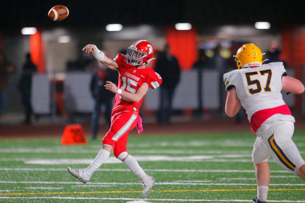 Stanwoods Michael Mascotti completes a short pass up the middle against Ferndale Friday, Oct. 21, 2022, at Stanwood High School in Stanwood, Washington. (Ryan Berry / The Herald)