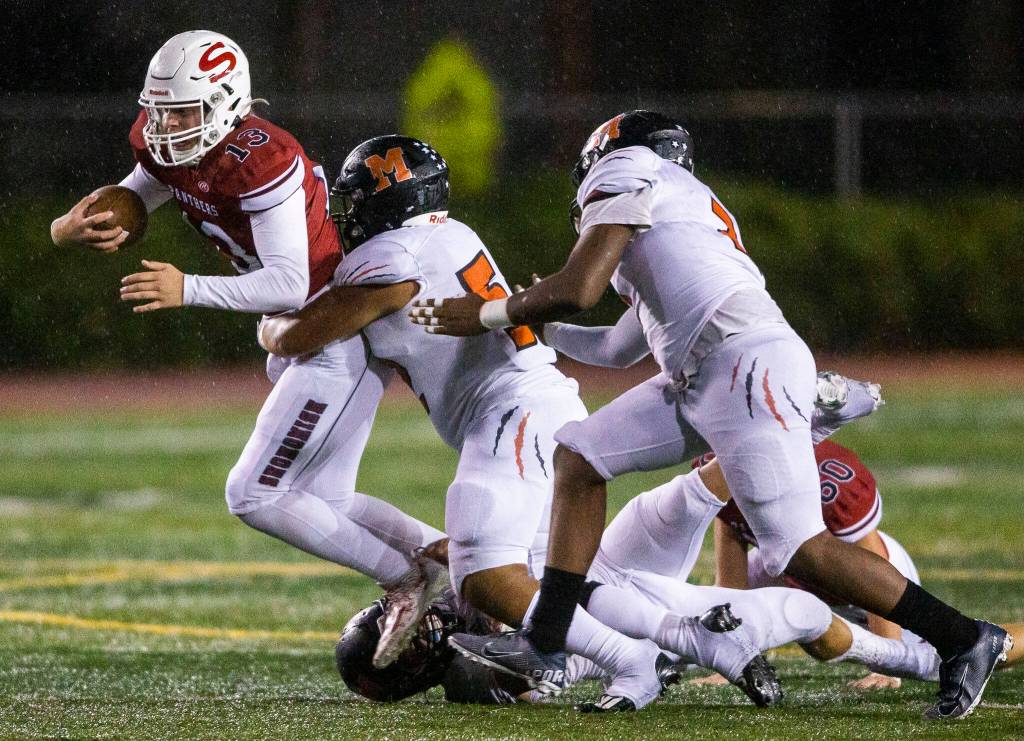 Monroes Tyer Lynch sacks Snohomish quarterback Kale Hammer. The Bearcats defense allowed just 206 total yards. (Olivia Vanni / The Herald)
