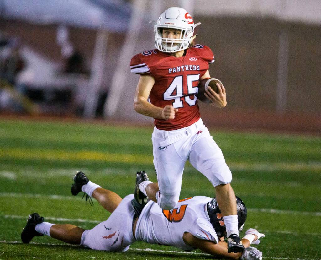 Snohomishs Caleb Podoll runs the ball during a game against Monroe on Friday, Oct. 21, 2022 in Snohomish, Washington. (Olivia Vanni / The Herald)