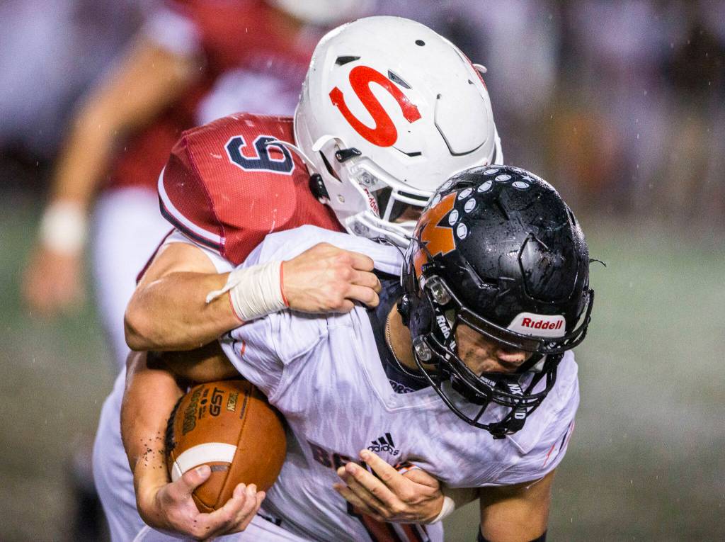 Snohomishs Brody Strandt completes a tackle during a game against Monroe on Friday, Oct. 21, 2022 in Snohomish, Washington. (Olivia Vanni / The Herald)