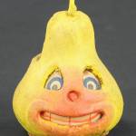 Imagine seeing a glowing, grinning pear in the dark of night! This papier-mache lantern was an antique Halloween decoration.