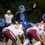 Shorewoods Rory Swanson calls out to a wide receiver before a play against Cascade on Wednesday at Shoreline Stadium. (Ryan Berry / The Herald)