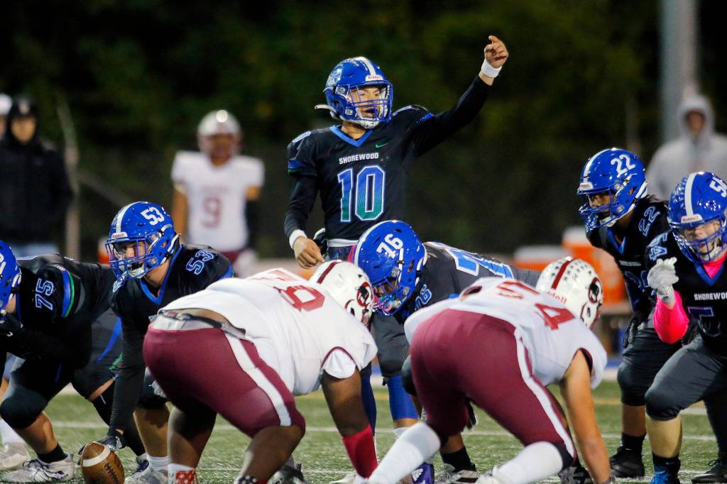 Shorewoods Rory Swanson calls out to a wide receiver before a play against Cascade on Wednesday at Shoreline Stadium. (Ryan Berry / The Herald)