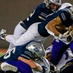 Glacier Peak's Trey Leckner jumps for extra yardage at Veterans Memorial Stadium Friday night in Snohomish on October 29, 2021. (Kevin Clark / The Herald)