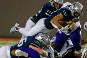 Glacier Peak's Trey Leckner jumps for extra yardage at Veterans Memorial Stadium Friday night in Snohomish on October 29, 2021. (Kevin Clark / The Herald)