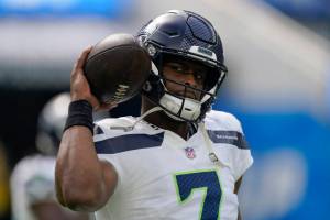 Seattle Seahawks quarterback Geno Smith (7) warms up before an NFL football game against the Los Angeles Chargers Sunday, Oct. 23, 2022, in Inglewood, Calif. (AP Photo/Mark J. Terrill)