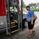 Doug Wennerberg boards the ParaTranist bus on Thursday, Sept. 1, 2022 in Everett, Washington. (Olivia Vanni / The Herald)