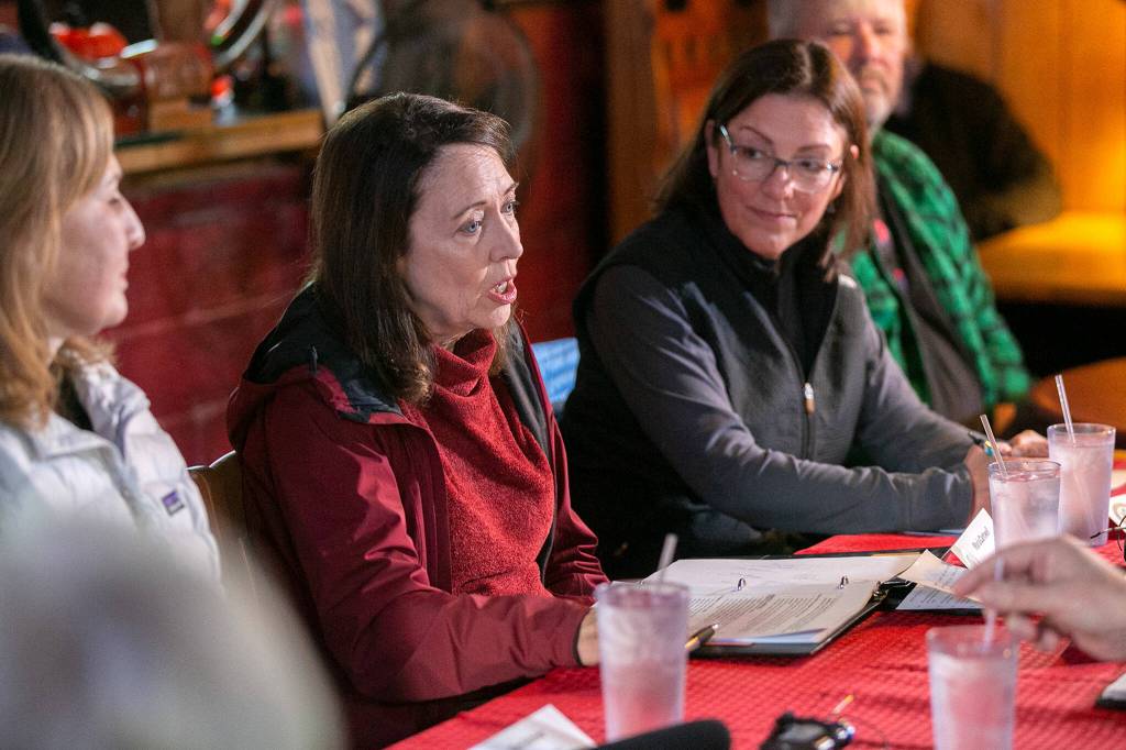 Senator Maria Cantwell, flanked by congresswomen Suzan DelBene and Kim Schrier, speaks about the local impact of the Bolt Creek fire during a meeting of local and state leaders addressing the aftermath of the fire on Thursday, at Bubbas Roadhouse in Sultan. (Ryan Berry / The Herald)