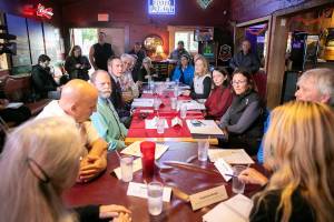 More than a dozen local leaders gather around to discuss short and long-term needs during a meeting addressing the environmental, safety and economic impacts of the Bolt Creek fire on Thursday, Oct. 27, 2022, at Bubba’s Roadhouse in Sultan, Washington. In attendance were State and U.S. politicians, the mayors of several Highway 2 towns, and other leadership from Snohomish and King counties (Ryan Berry / The Herald)