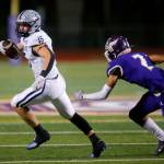 Glacier Peaks Trey Leckner turns up the field after spinning out of a tackle on his way to a long touchdown reception against Lake Stevens on Friday, Oct. 28, 2022, at Lake Stevens High School in Lake Stevens, Washington. (Ryan Berry / The Herald)